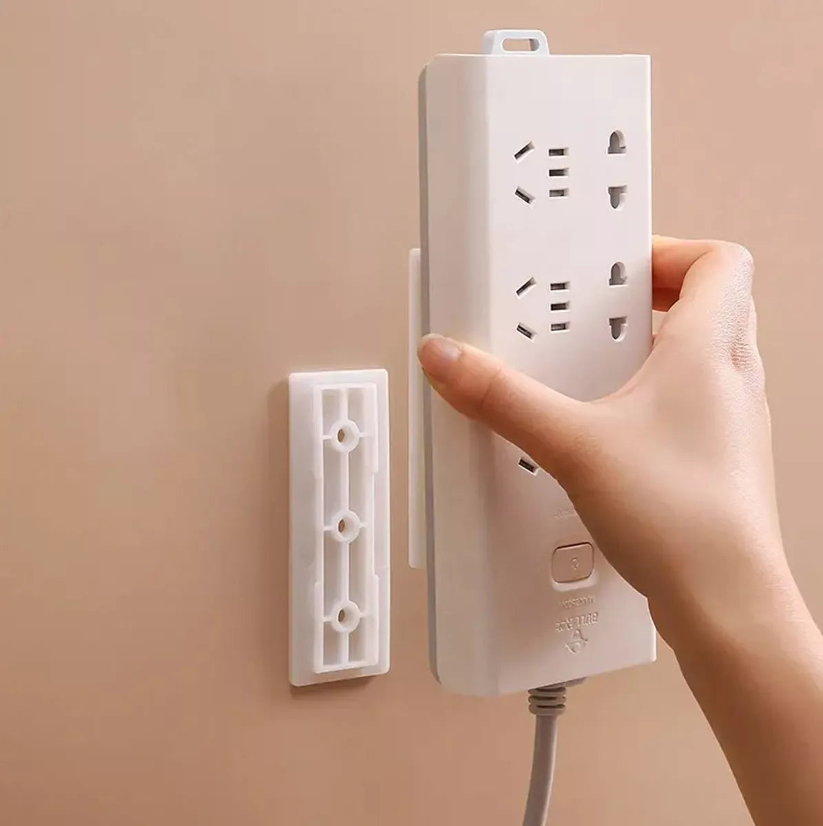 Nástěnný držák pro elektrickou pásku
